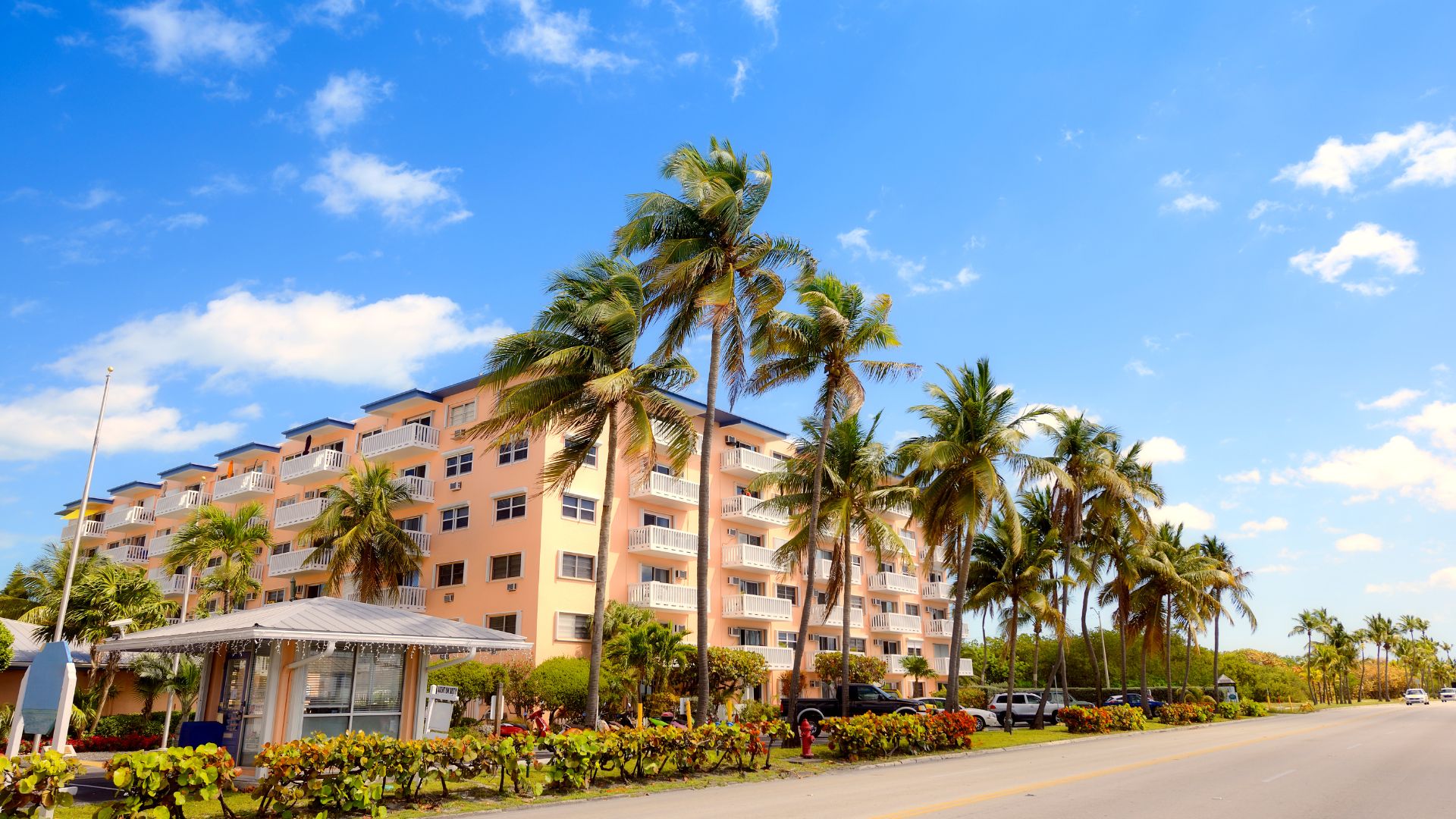 Website%20Dev.%20-%202025-07-02T154217.670 exterior of an apartment video in central florida surrounded by palm trees